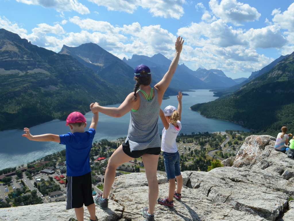Jami Savage and kids posing on the top of Bear's hump hike in Waterton Lakes National Park 