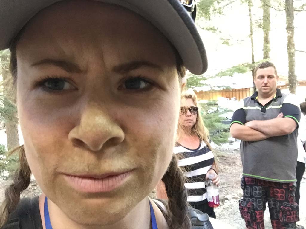 woman with dirt covered face after Whistler ATV Tours