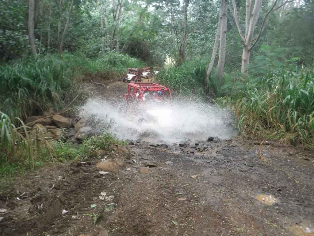 ATV going through the mud on the Kauai ATV tour