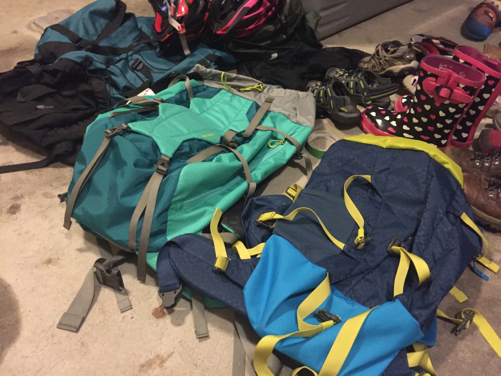 Used backpacks at a flea market for the best deals on outdoor gear