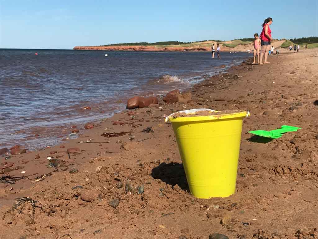 Kids playing on the beach in the PEI national park