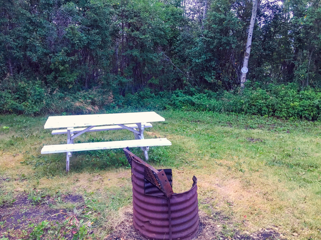 Spruce Bay picnic table and fire pit from camping in the Canadian Badlands