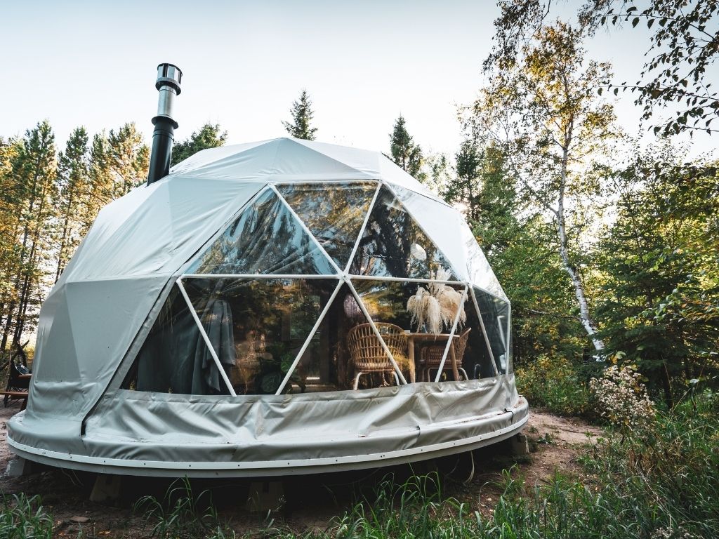 geo dome hotel room surrounded by a forest