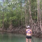 woman stand up paddle boarding at the run like a girl adventure retreat in costa rica